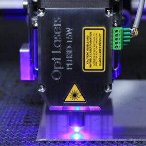 a close up of a machine with a purple light