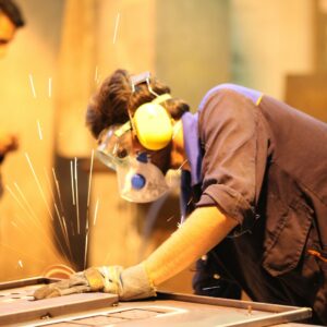 person in blue t-shirt wearing blue mask